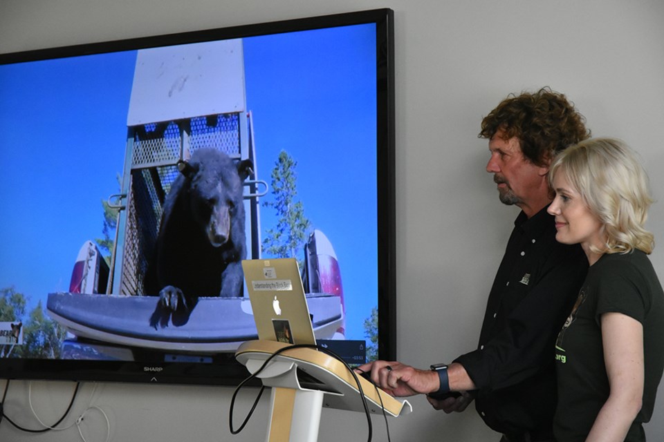 Mike and Ella McIntosh used slides and videos to talk about Ontario's Black bears, and the work of Bear With Us Sanctuary. Miriam King/Bradford Today