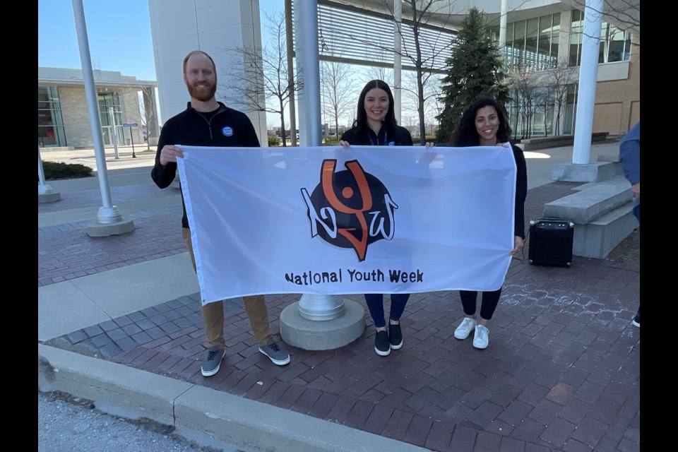 BWG Leisure Centre's Jeremy McNaught, Bianca Mendes, and N'Diia Maharaj helped lead the flag raising for National Youth Week.