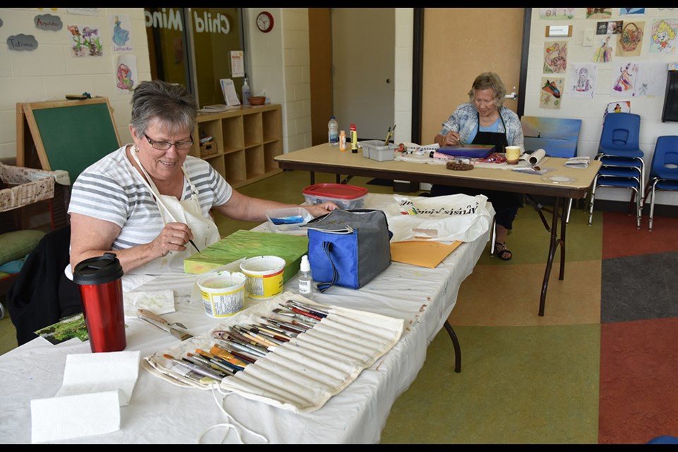 Stella Wadsworth, left, and Kathy Bury do their painting at the Creative Art Space on Thursday afternoons. Miriam King/BradfordToday