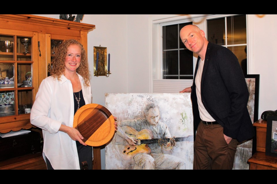 Wood-turner Anastasia Cheetham and artist Liam Jones, with examples of their work. Submitted photo/Barb Baguley 