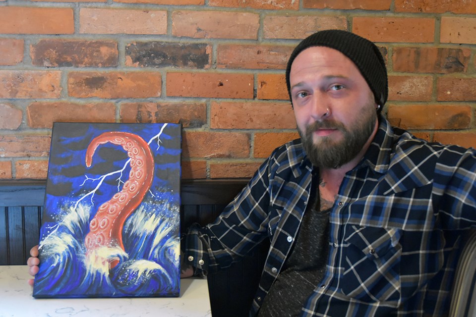 Artist Chad Williams, with painting inspired by Jules Verne's 20,000 Leagues Under the Sea. Miriam King/Bradford Today