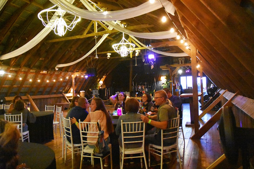 Guests fill the tables at the Bradford Barn on Aug. 16, for a Woodstock Party, and performance by Green River Revival, Credence Clearwater Tribute. Miriam King/Bradford Today