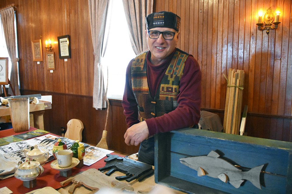 Denis Bolohan with early works, and postcards of his large-scale labyrinths, at the Artisans' Fair in Newton Robinson, Nov. 16. Miriam King/Bradford Today