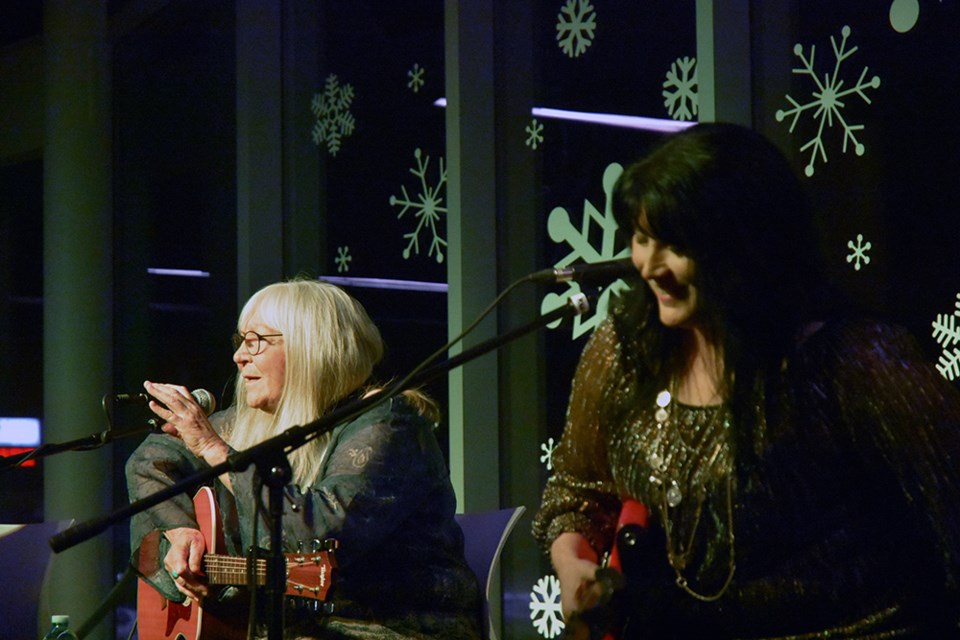 'Mama Mabel' Eva Levesque, left, tells a story on stage during a concert in Innisfil. Miriam King/Bradford Today