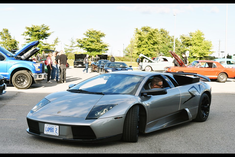 Lamborghini parks at the BWG Public Library, for a Friday evening meeting of the Back Alley Cruisers Car Club. Miriam King/Bradford Today