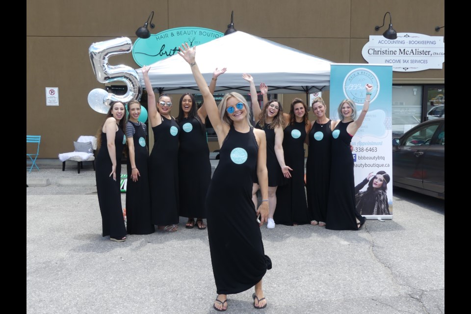 Brittany Buck, owner of Brittany Buck Hair and Beauty Boutique, and her staff celebrate the business's fifth anniversary. Jenni Dunning/Bradford Today