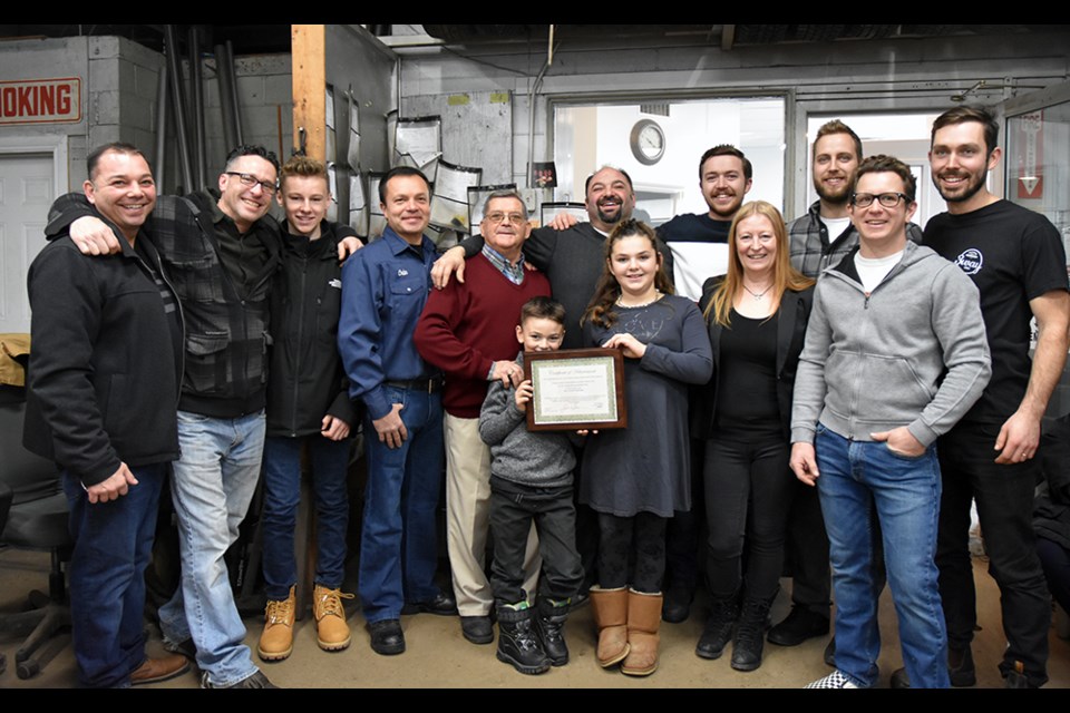 Vasco Duraes (centre) with daughter Addison, nine, son Cameron, six, and dad Dom, staff and, at left, brother George, at the 40th anniversary of D.D. Eagles & Sons Inc. Miriam King/BradfordToday