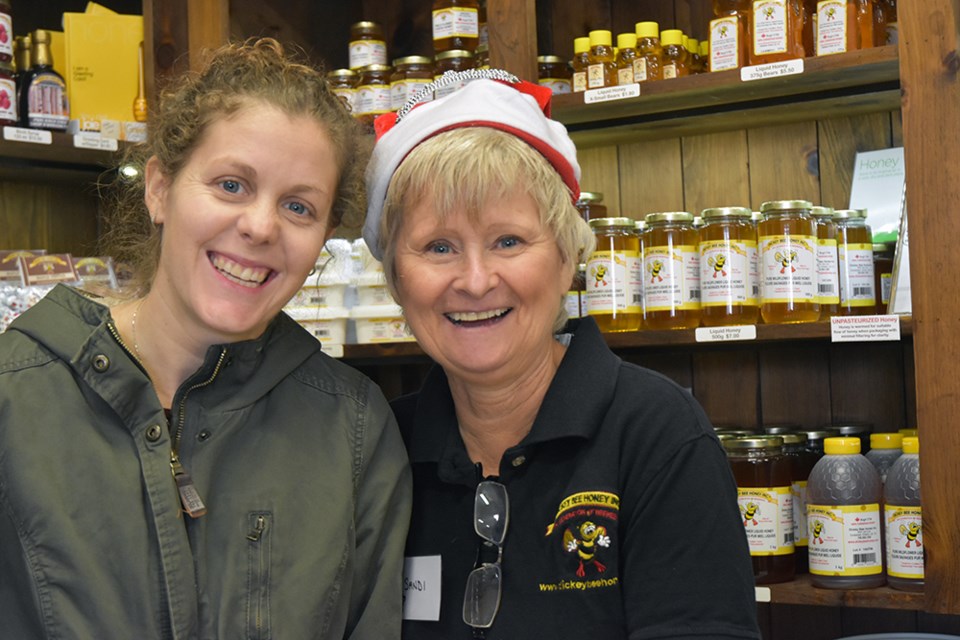 Sandi Dickey (right) and customer Laura Hope at the Dickey Bee Honey. Miriam King/Bradford Today