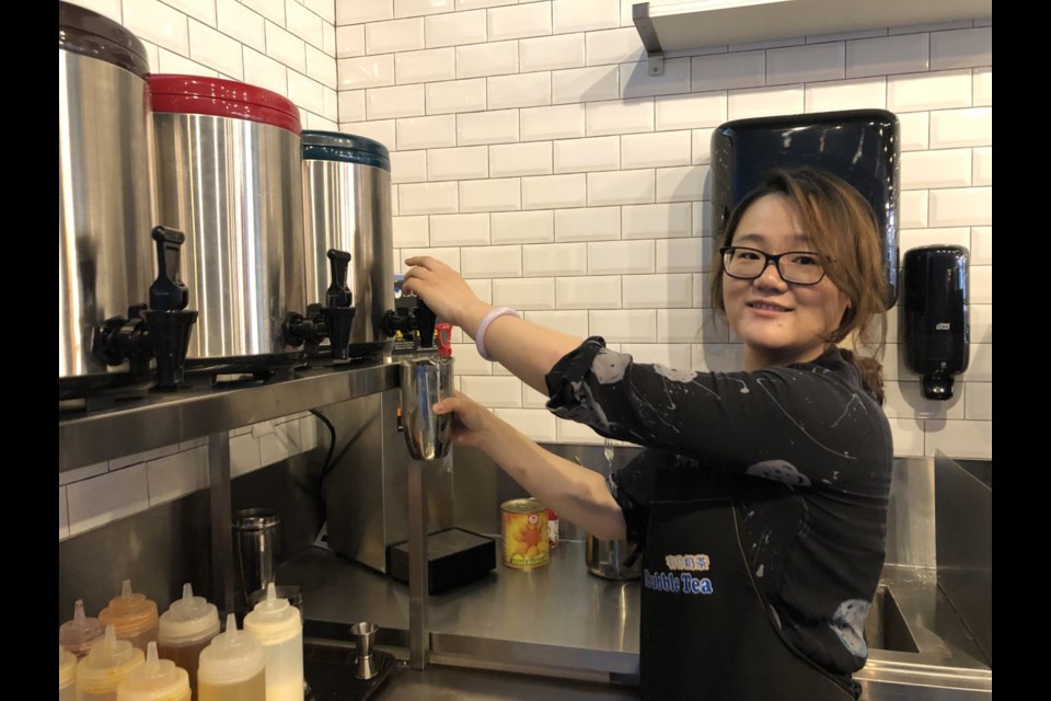 One of the owners of Uni Bubble Tea, Lucy Shen, whipping up a tea for a customer. Natasha Philpott for BradfordToday
