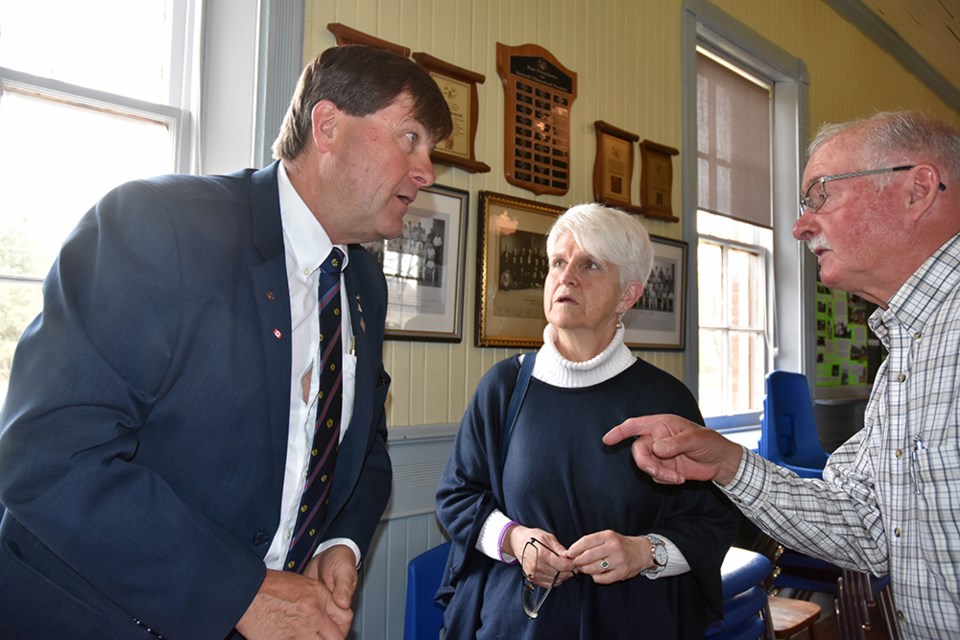 From left, guest speaker John Trotter chats with Mary Black and Merv Wice, at the meeting of the Innisfil Historical Society. Miriam King/Bradford Today