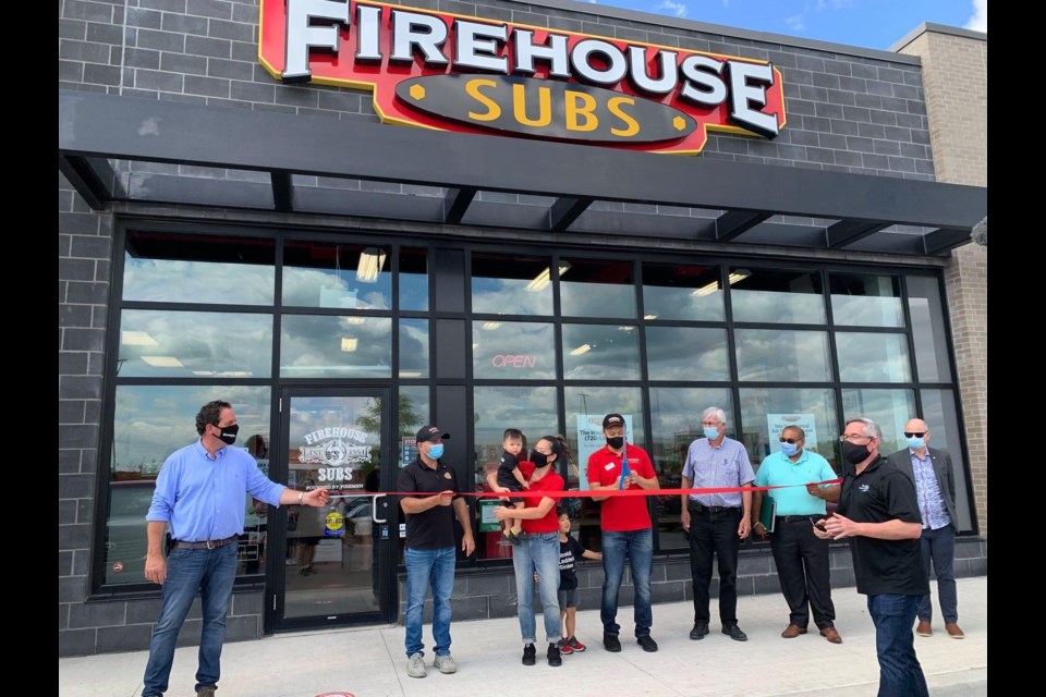Members of the Bradford community welcome franchise owner Jonathan Chang and his family to the Bradford business community on Tuesday morning. Submitted