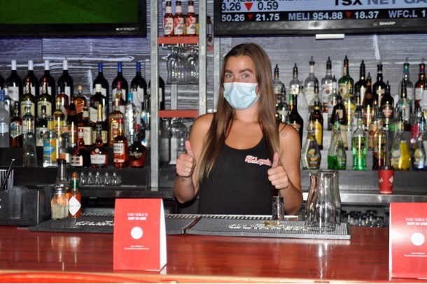 Bartender Cass Johnson is ready and excited to serve St Louis’ patrons indoors this weekend. Jackie Kozak for BradfordToday