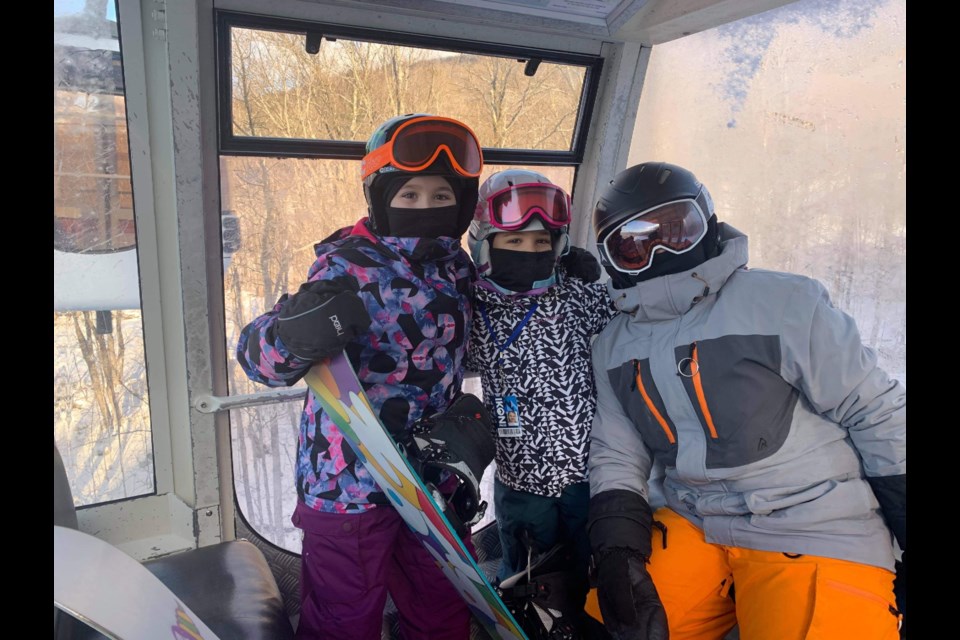 Dwayne Cardoso's kids (Ava, Brianna, and Eli) enjoying the slopes outside of Ontario where ski resorts are open. Eli is autistic and is more relaxed and calm when snowboarding. 