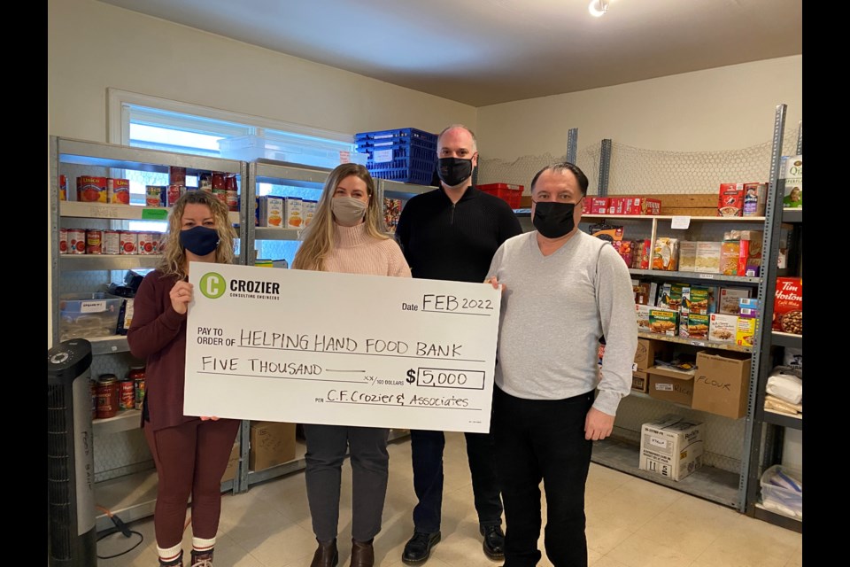 Associate Jim Koutroubis, Branch Manager Geoff Masotti and Marketing Coordinator Christine Hansen were happy to present the $5K cheque to Food Bank President Carolyn Khan