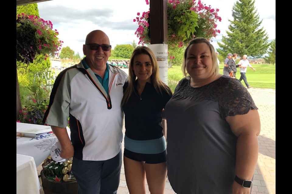 Coun. Mark Contois, St. Louis Bar and Grill Manager, Amber Morrison, and volunteer, Nicole Kim waiting for the tournament to begin. Natasha Philpott/BradfordToday