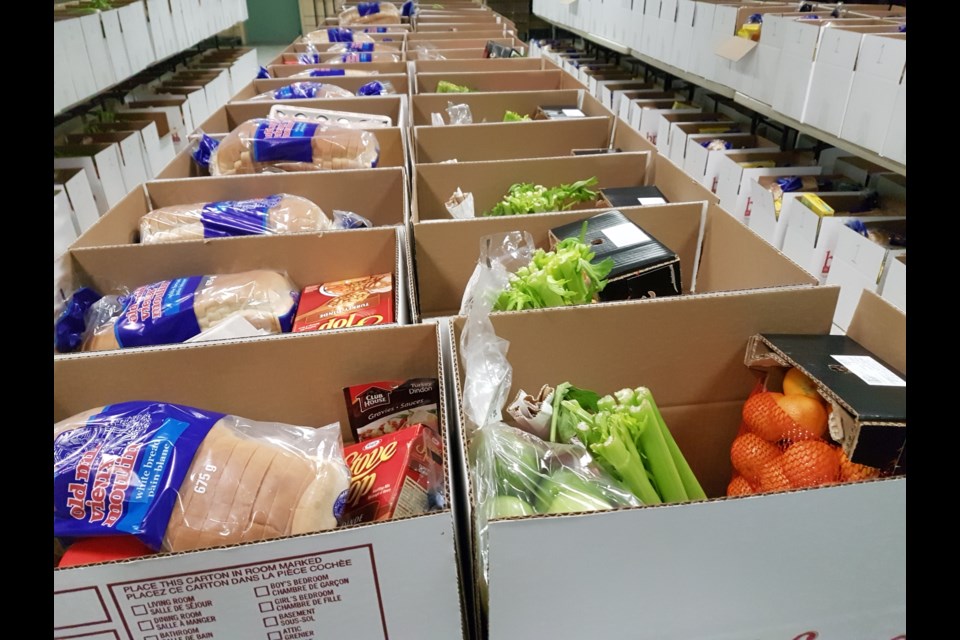 The Helping Hand Food Bank has a team of volunteers who help organize the Christmas Hampers every year. Submitted Photo.