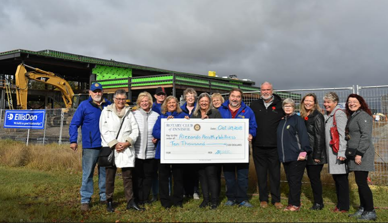 Innisfil Rotary Club members present a cheque for $10,000 to members of Innisfil town council, including ex-Mayor Gord Wauchope and Mayor-elect Lynn Dollin, and members of the Rizzardo Health and Wellness Centre fundraising committee. Miriam King/BradfordToday
