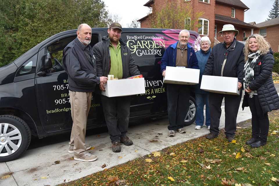 From left, William Silvey, Bradford Greenhouses’ Trevor Auton delivering donations to Oliver Pajunen, Anne Silvey, Alvin Belanger and Carolyn Khan. Miriam King/BradfordToday