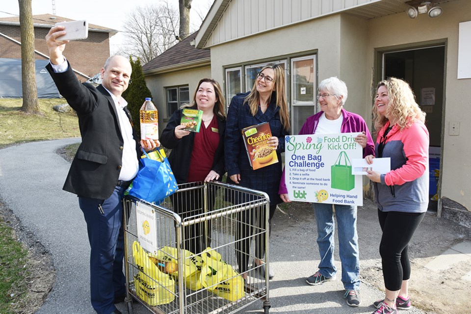 Donating a bag of food, then taking a selfie - from left, Bradford Board of Trade members Director Ryan Charron, Chief Administrative Officer Tricia Barrett-Butler, VP of Public Relations Jennifer Harrison, with Food Bank president Anne Silvey and volunteer Carolyn Kahn. Miriam King/Bradford Today