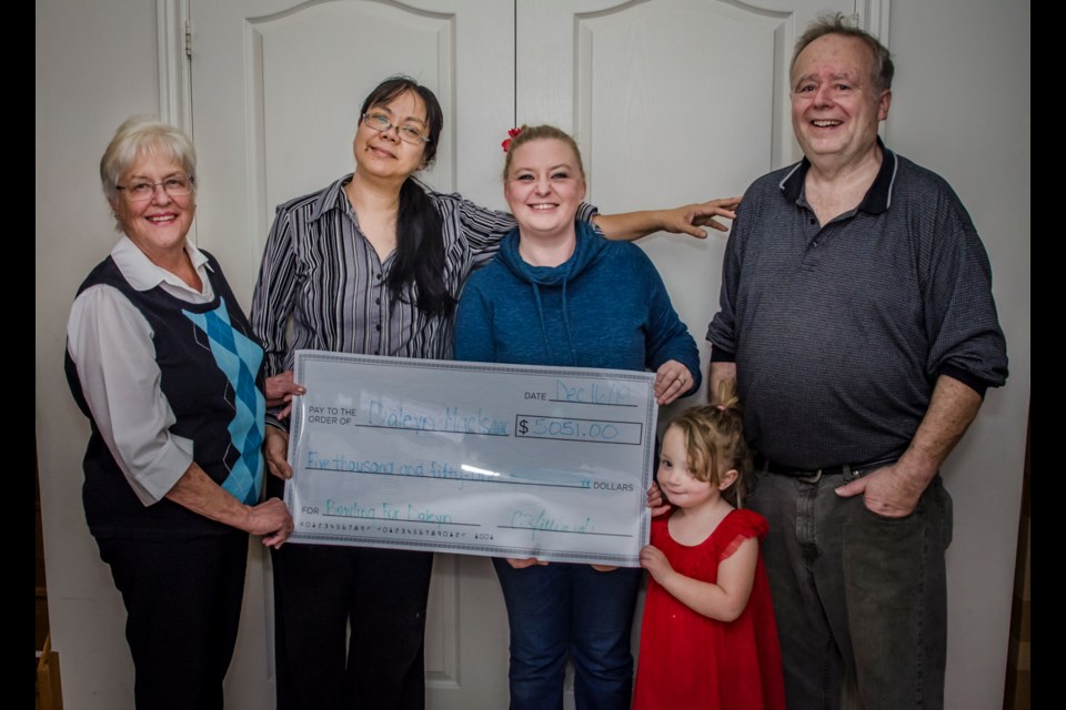 The MacIsaac family was presented with over $5000 raised from the Bowling for Daleyn event. From left to right: Sandy Hudson, Minerva MacIsaac, Cassidy Hilliard, Cassidyâs daughter Summer and Dale MacIsaac. Dave Kramer for BradfordToday.