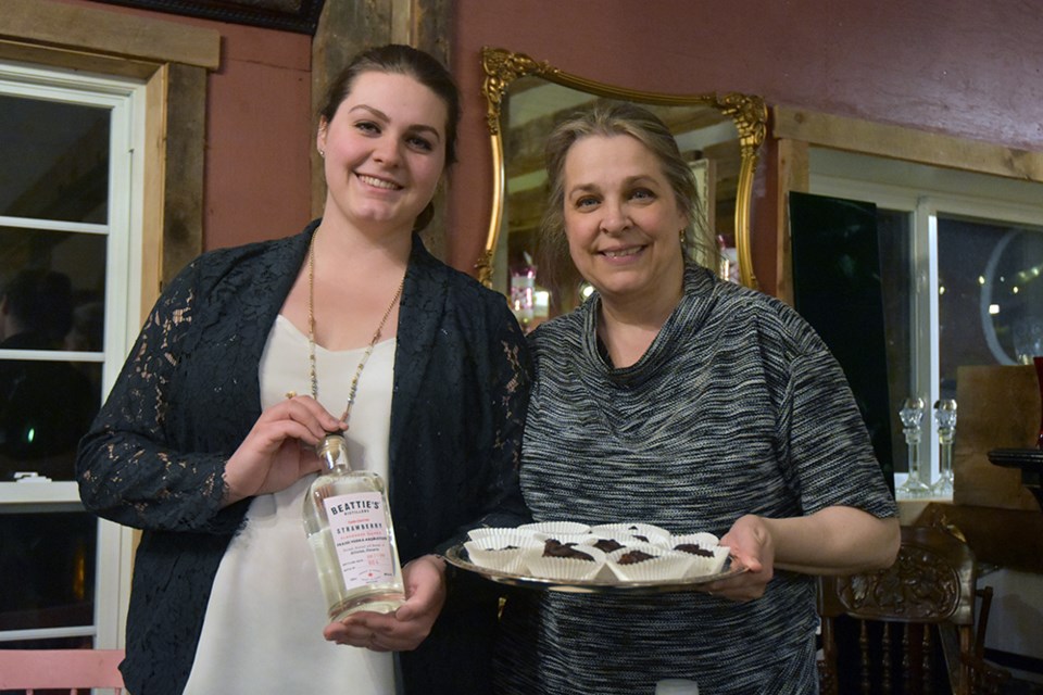 Diana Robinson, right, and daughter Abigail with a pairing of Vegan brownies and Strawberry Vodka, at the Cookstown Antique Market. Miriam King/Bradford Today