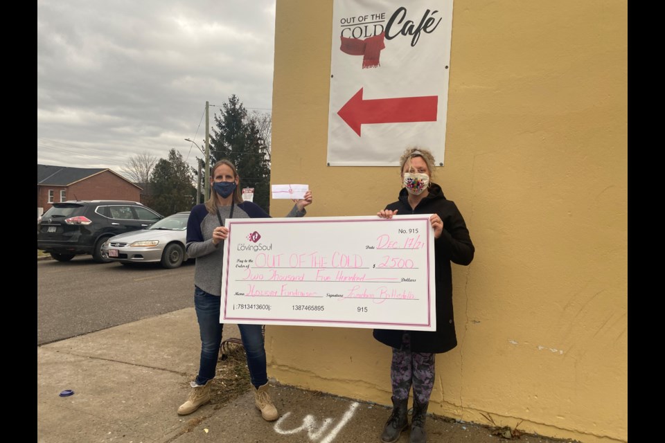 Loredana from The Loving Soul donates funds from her holiday fundraiser to Out of the Cold Cafe