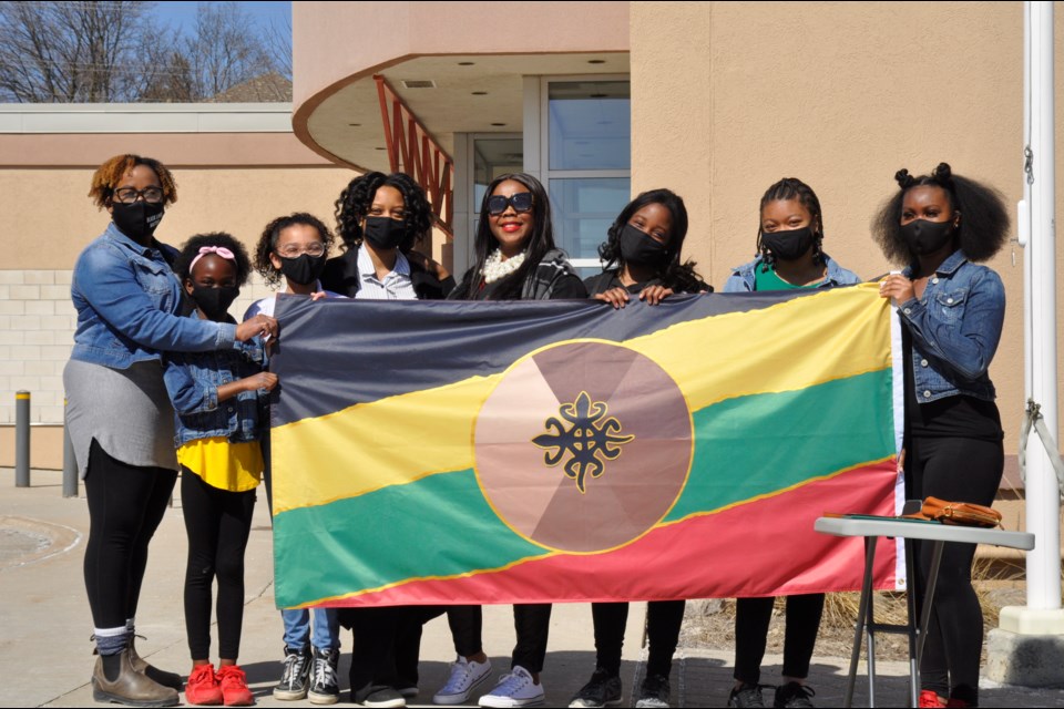 Members of the group IMPACT Youth and Cultural Centre and creators of the new BWG flag for Anti-Black Racism. 