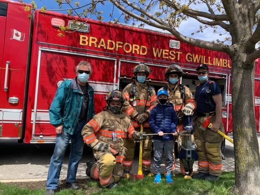 Volunteer Fire Fighters stopped by on Saturday to wish Chiari-warrior Mason Donkin a happy birthday, including surprise visits from retired FF Allan Grant (far left) and the President of the Volunteer FF Association Jeff Torcato (left of Grant). 