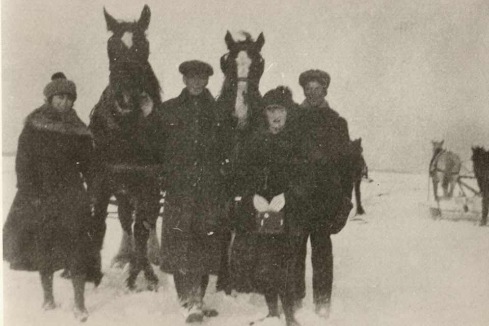 Teams of horses scraped the ice prior to cutting. Many of the employees were local farmers who found seasonal work with the Lake Simcoe Ice Company.