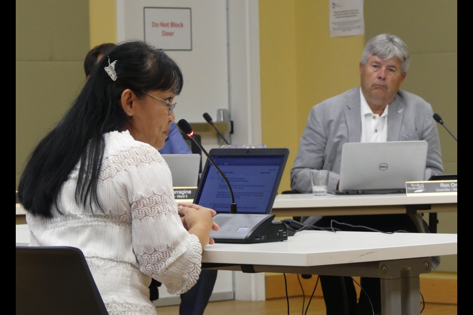 Punnapa Hartley, left, director of care at Bradford Valley Care Community, speaks to BWG council, as Coun. Ron Orr listens. Jenni Dunning/BradfordToday