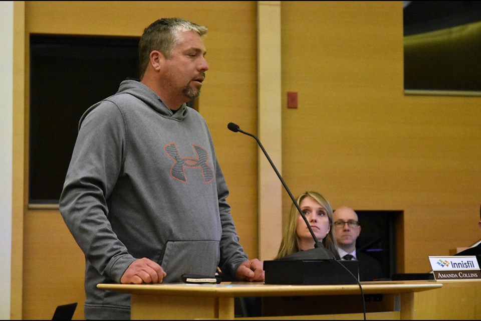 Innisfil resident Scott Mingay asks Council for assurance sewer back-up won't happen again. Miriam King/Bradford Today