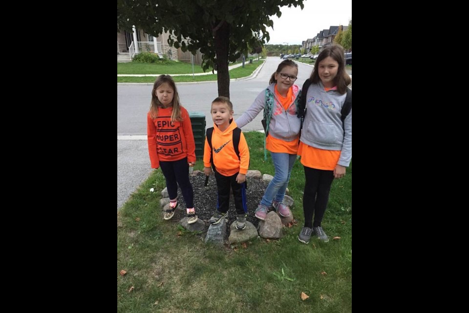 Madison, 11, Charlotte, 9, Samantha, 7, and Zakkary, 4, sporting their orange shirts today. Photo supplied