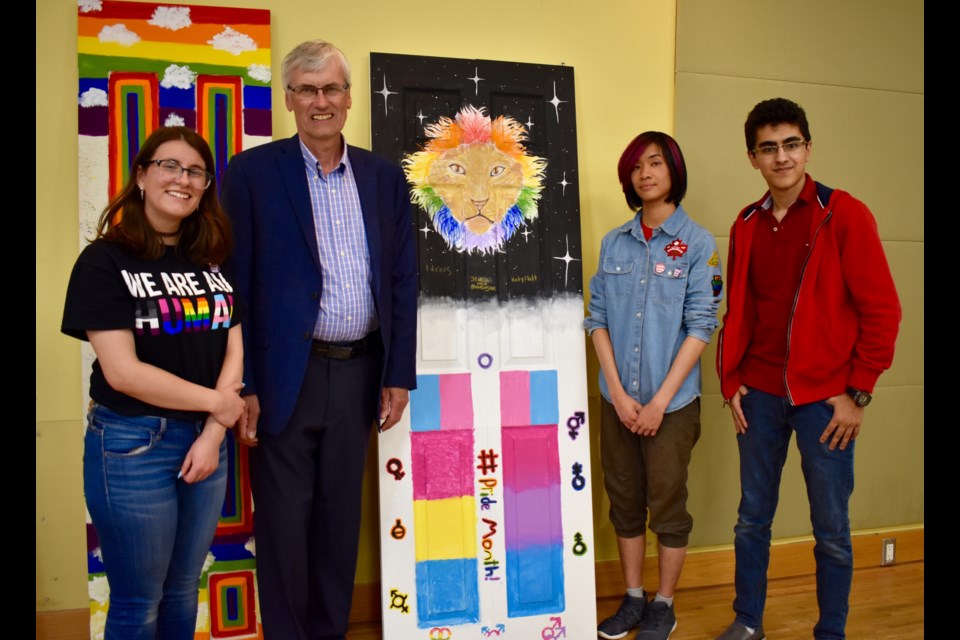 BWG Mayor Rob Keffer, second from left, with the artists of the door with the lion, Katy Flatt, Jewell Hua, and Idrees. Melanie Pileggi for BradfordToday