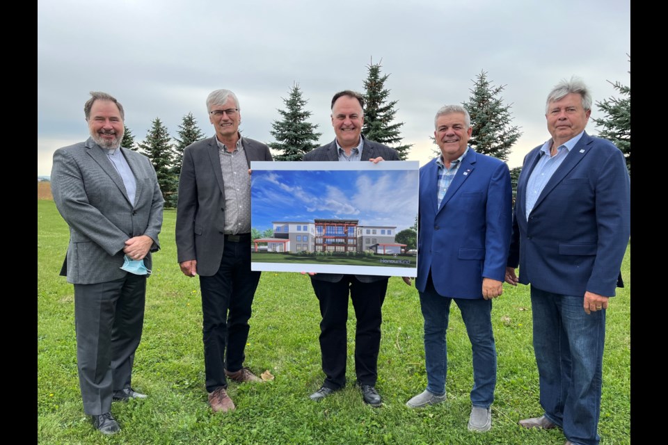 Pictured with a rendering of a new memory-care home are Mayor Rob Keffer, Deputy Mayor James Leduc, Coun. Ron Orr, HonourKind president Dale Beasse and Rev. Daniel Scott of St. John’s Presbyterian Church.