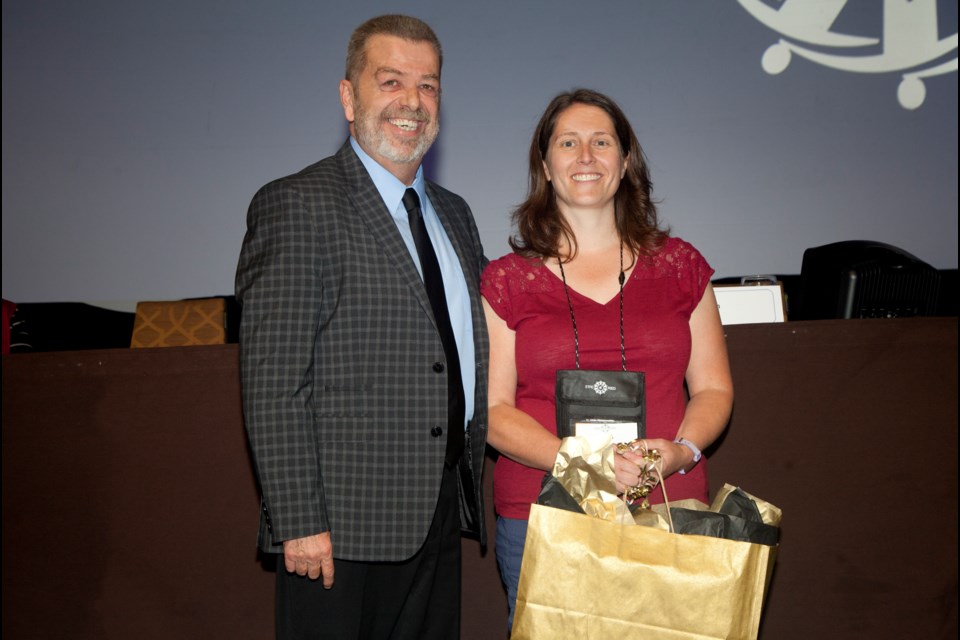 Bradford teacher, Amy Stepanek receiving her award last week from Elementary Teachers' Federation of Ontario president, Sam Hammond. Submitted photo from EFTO