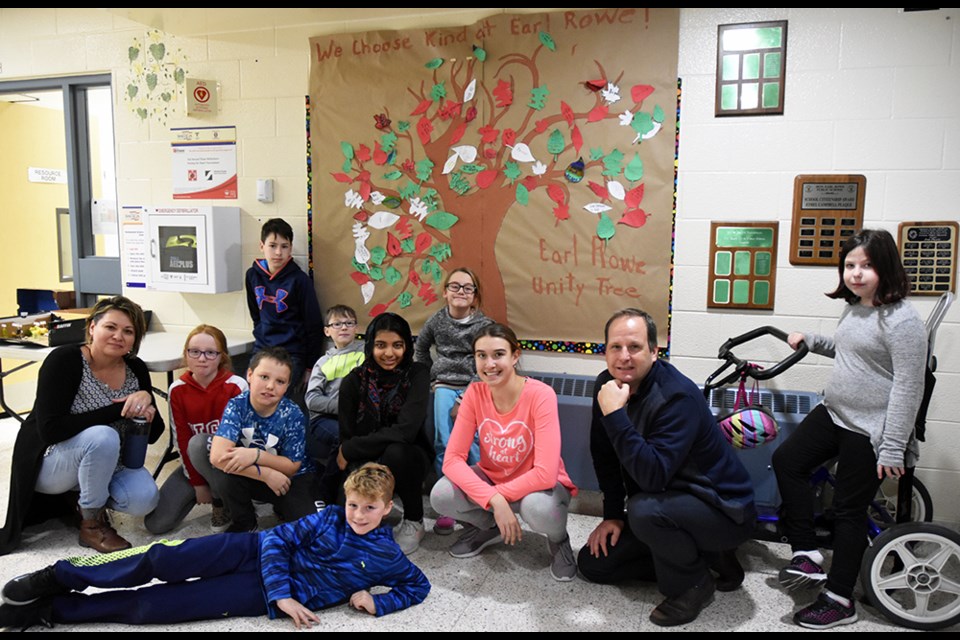 Staff and students of the Safe Schools Team are joined by Principal Christopher Kemp in front of the Unity Tree at Hon. Earl Rowe PS. Miriam King/Bradford Today