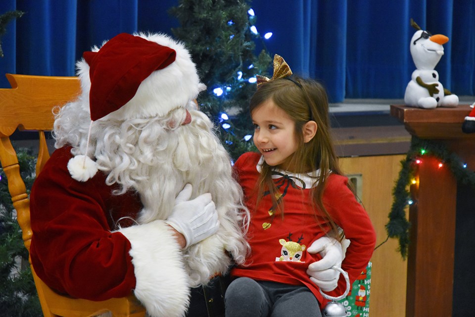 Visit from Santa Claus delighted kids at St. Teresa of Calcutta Catholic School, Dec. 7. Miriam King/Bradford Today