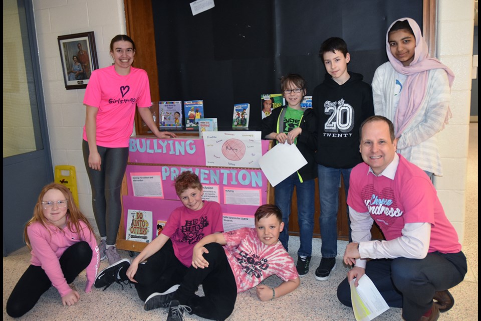 Safe Schools Team at Hon. Earl Rowe Public School pose with Principal Christopher Kemp, on Pink Shirt Day. Miriam King/Bradford Today