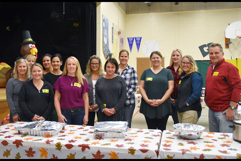 Parent volunteers ready to serve up the harvest lunch at Honourable Earl Rowe Public School on Friday. Miriam King for BradfordToday