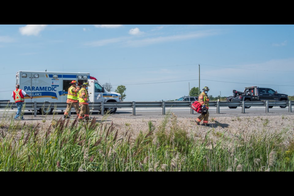 First responders head down to the vehicle that had left the highway. Paul Novosad for Bradford Today.