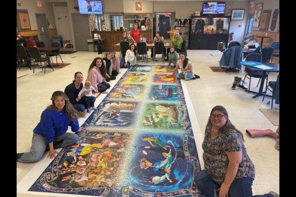 Group of local ladies complete 40K piece puzzle project (10 photos
