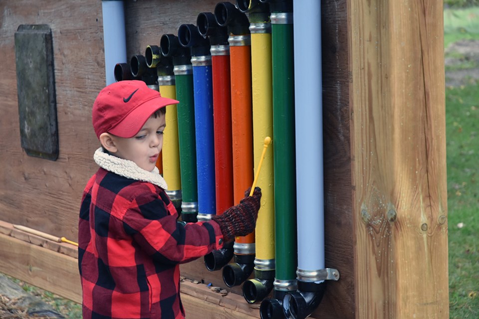 Parker, 3, plays 'Do-Re-Mi' on the pipe xylophone at the Discovery Play Garden at Scanlon Creek. Miriam King/Bradford Today