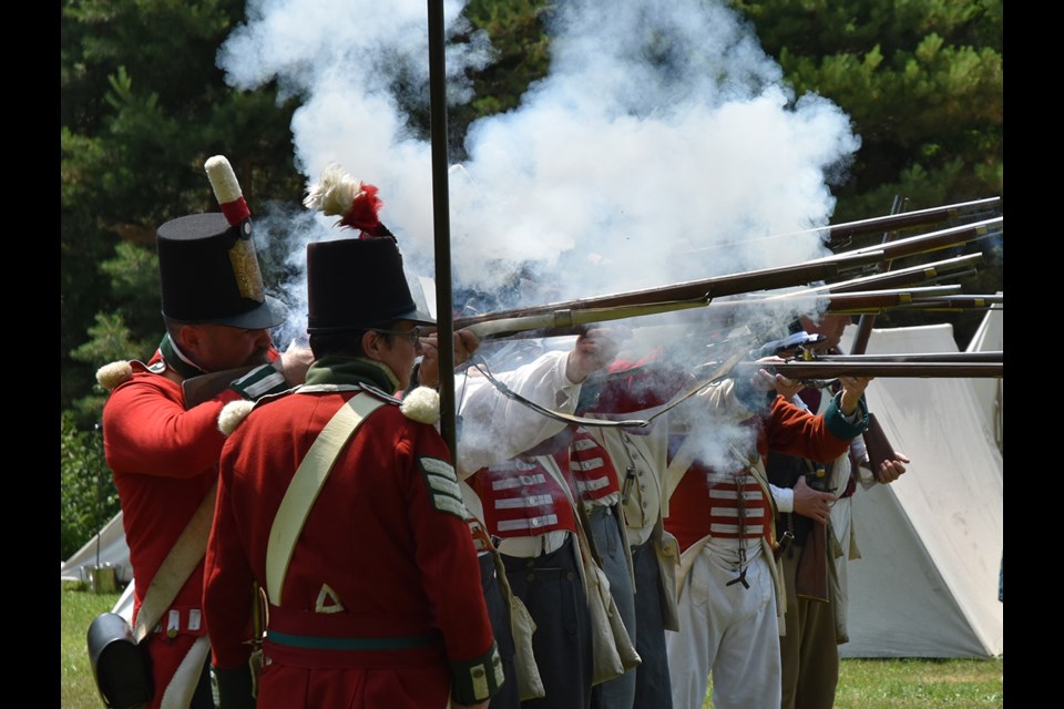 Loyalists advance on the rebels at Montgomery’s Tavern in a re-enactment at the Sharon Temple National Historical Site on Canada Day. Miriam King/Bradford Today