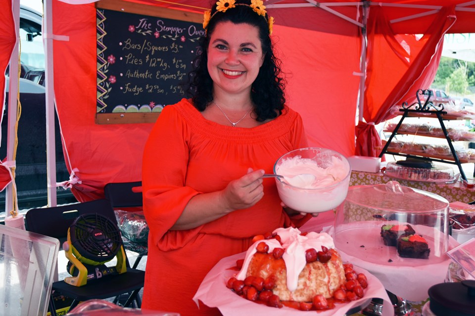 Jaime Grant of the Summer Oven Bakery prepares strawberry shortcake for market visitors. Miriam King/Bradford Today