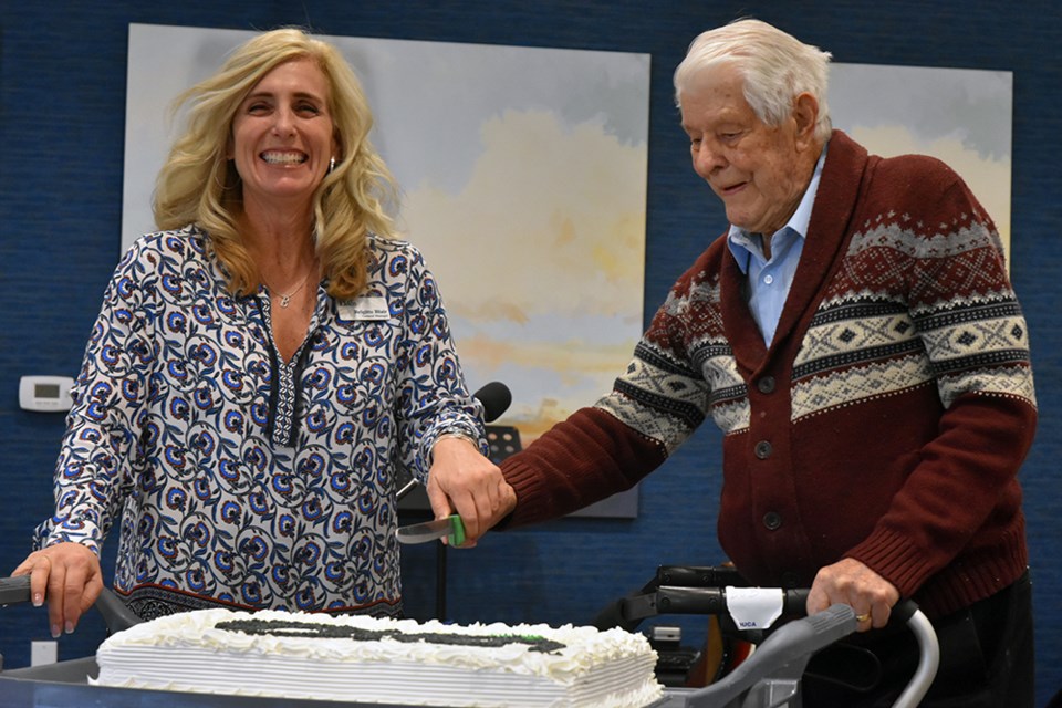 General Manager of The Elden Brigitte Blair and first resident Bob Sturgeon cut the cake, at The Elden's First Anniversary celebration. Miriam King/Bradford Today