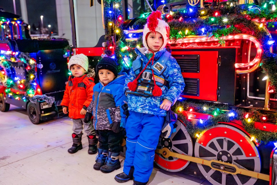 Young Jordan and his two friends were the first in line for the popular Santa train ride.