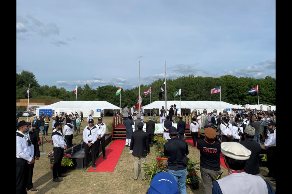 Ahmadiyya Muslim Community’s raising of the flags to signal the start of the annual convention.