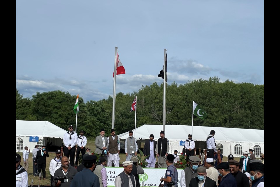 Ahmadiyya Muslim Community’s raising of the flags to signal the start of the annual convention.