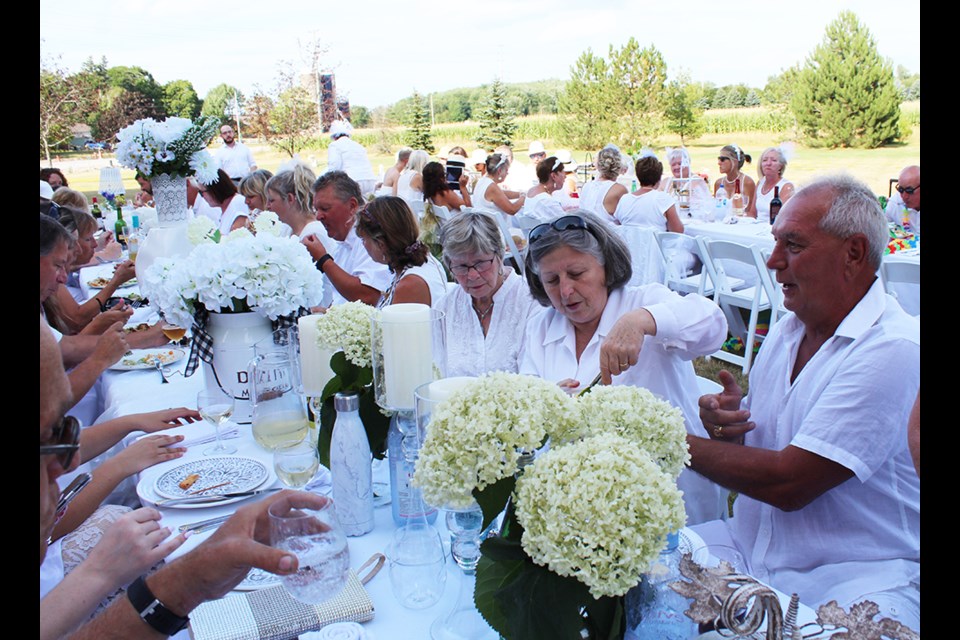 White clothes, white tablecloths and napery, white dishes - guests at Innisfil's Dinner in White, Aug. 18. Barb Baguley/Submitted photo