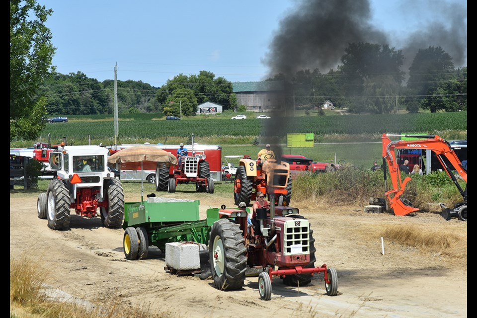 Georgian Bay Steam Club members held vintage tractor pulls during the day Saturday. Here, a 1950 Cockshutt competes in the 950-pound class. Miriam King/Bradford Today